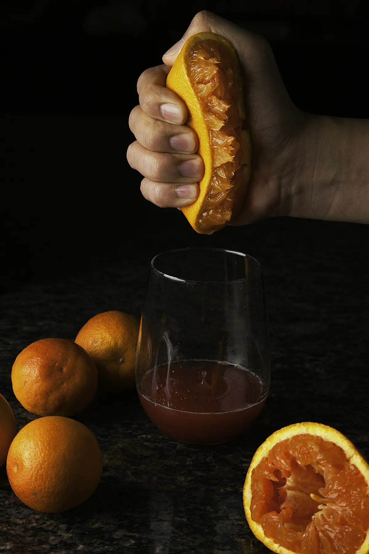 Blood oranges squeezed into a glass